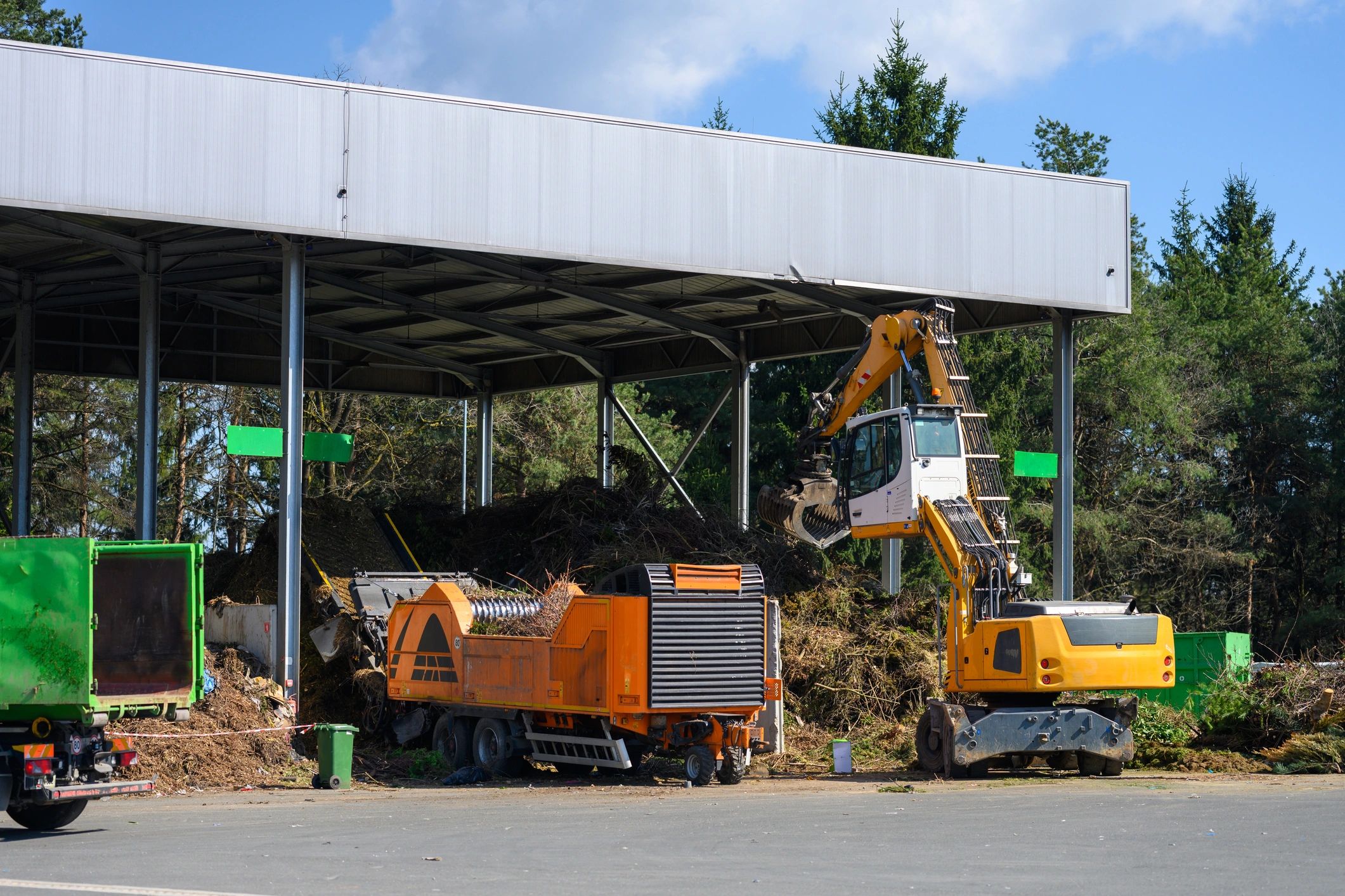 Heavy equipment handling land clearing and material processing